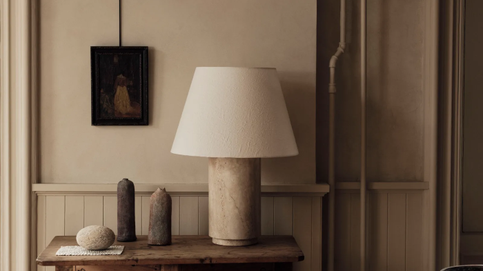 Vintage Style | This Parisian residence features soft wooden tones and classic black-and-white artwork, creating a warm and tranquil healing space.