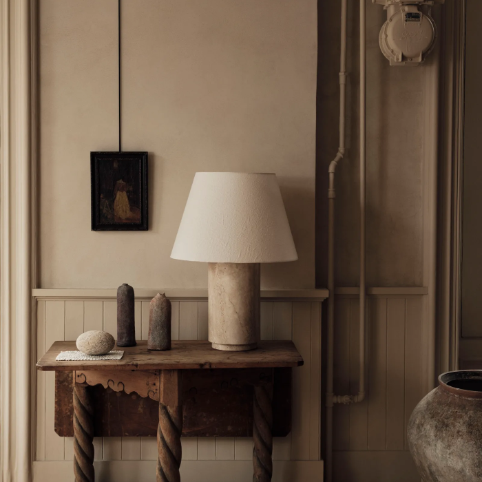 Vintage Style | This Parisian residence features soft wooden tones and classic black-and-white artwork, creating a warm and tranquil healing space.