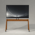 Front View White Background Image of Pootoo's MCM Mobile TV Stand with TV, showcasing its minimalist and elegant design, perfectly suited for modern home settings.