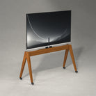 Side View White Background Image of Pootoo's MCM Mobile TV Stand with TV, clearly showcasing its modern design and practical functionality, suitable for various interior decor styles.