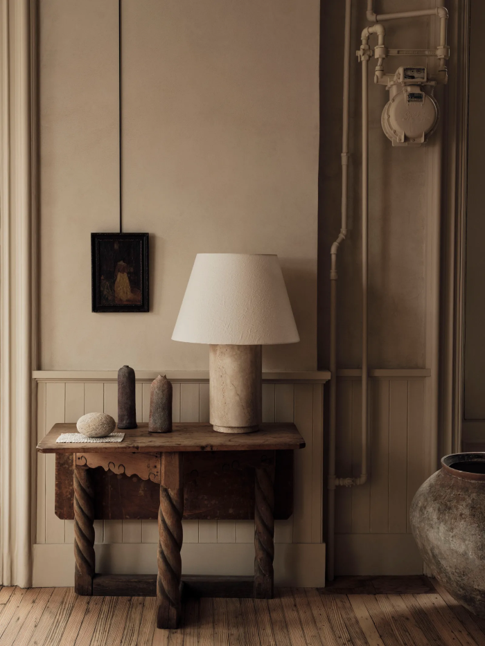 Vintage Style | This Parisian residence features soft wooden tones and classic black-and-white artwork, creating a warm and tranquil healing space.