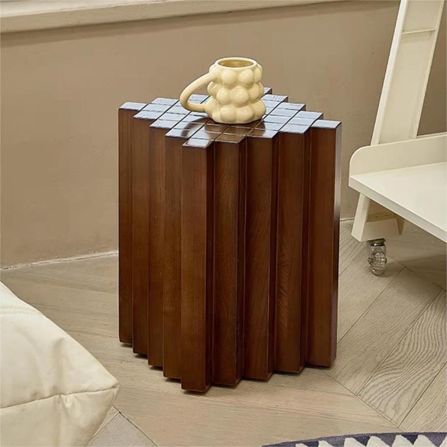 Pootoo's Checkerboard Side Table paired with a Light Yellow Mug, creating a warm atmosphere, with the unique design adding charm and personality to the space.